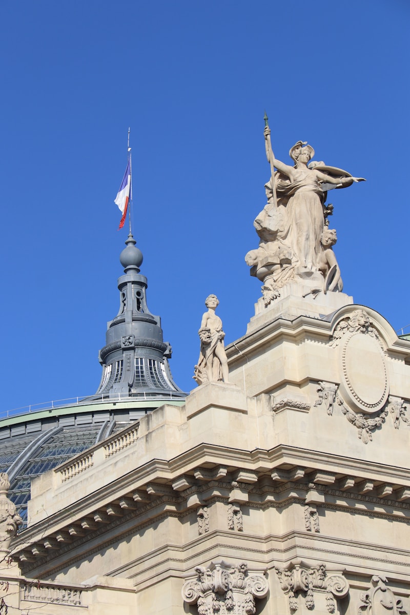Ornate building with statues under a clear blue sky